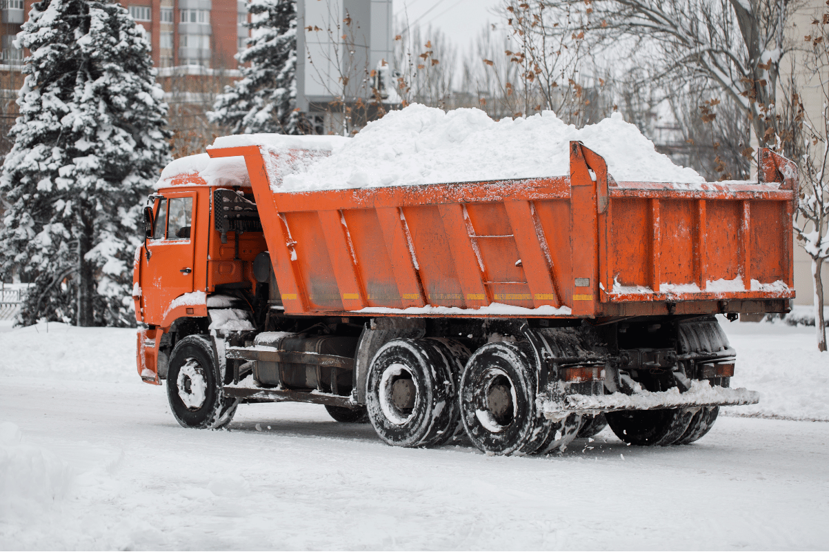 snow hauling dump truck winter parking lot