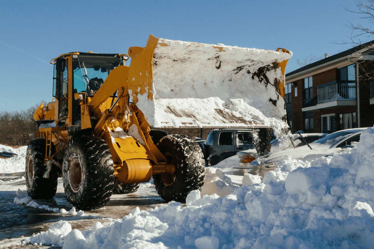 snow removal parking lot snow pile loader