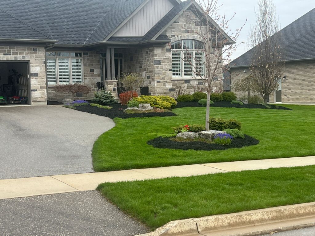 Curb landscaping outside house in Kitchener, ON