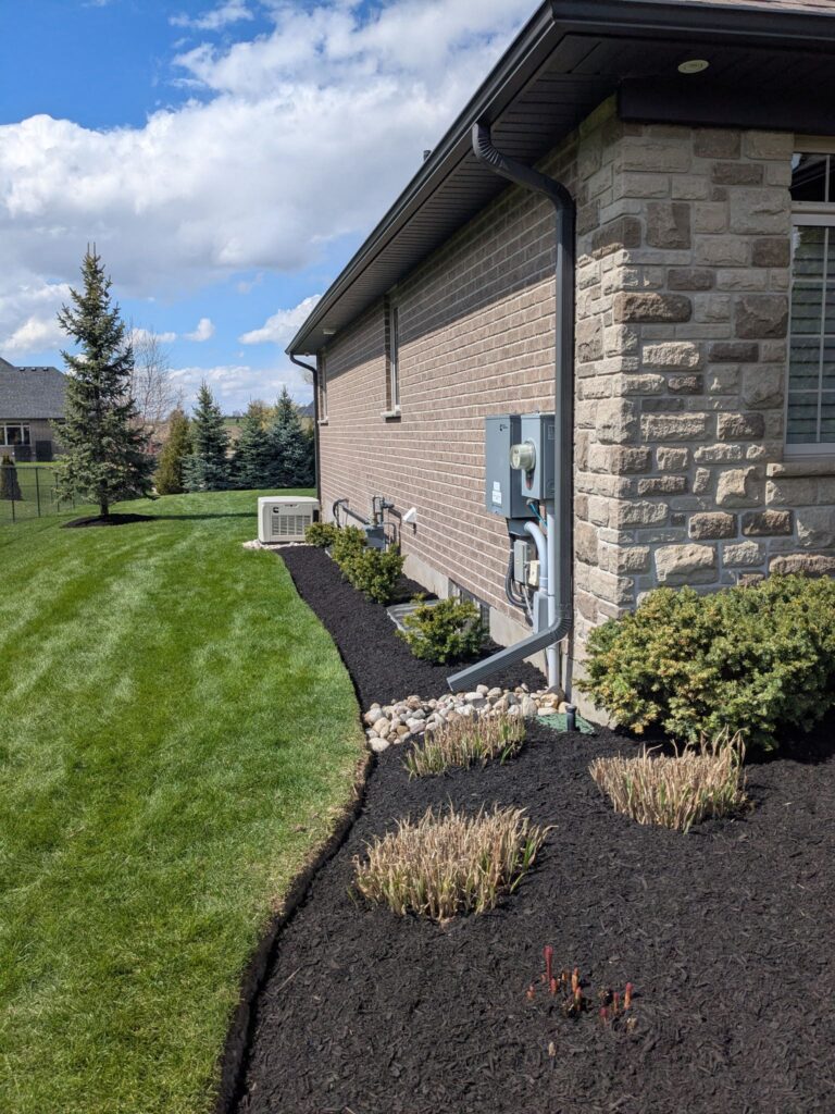 Mulching and sidewalk by True North Property Care Kitchener
