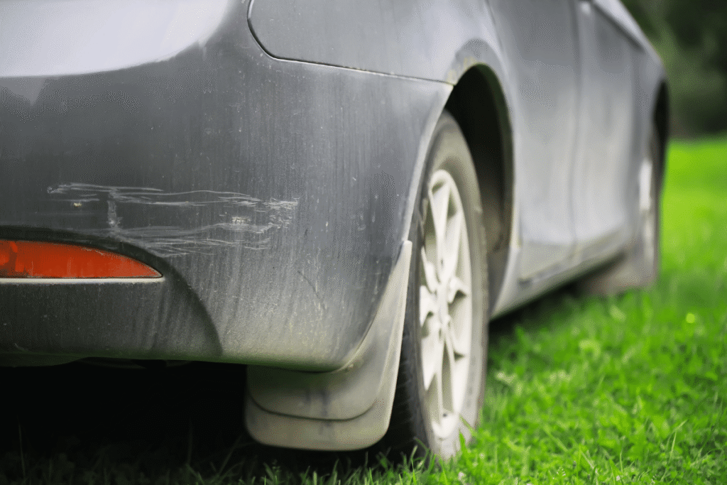 car parked on grass lawn damage