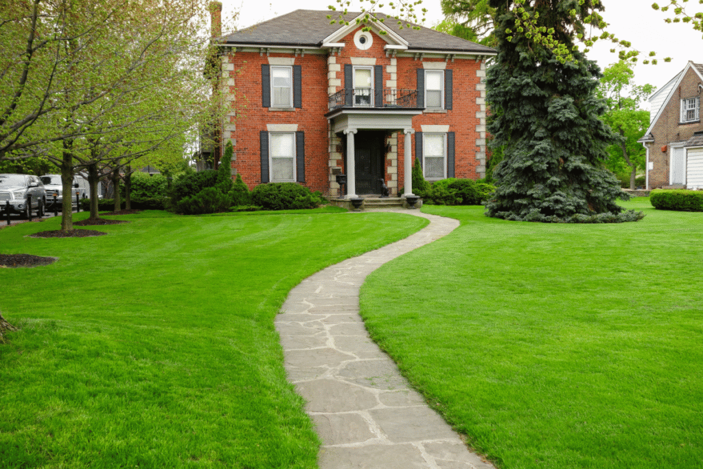 healthy green lawn in front of house Canada