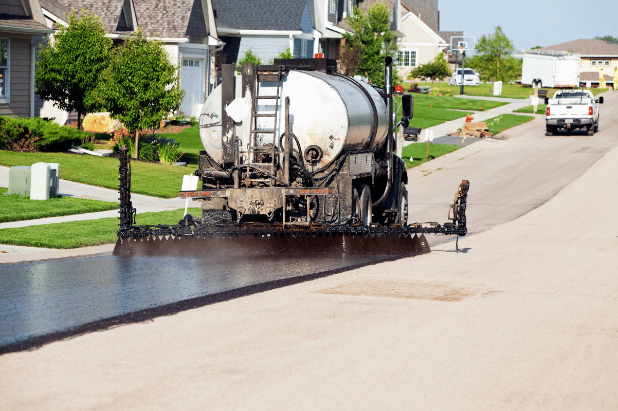 applying asphalt seal coat squeegee